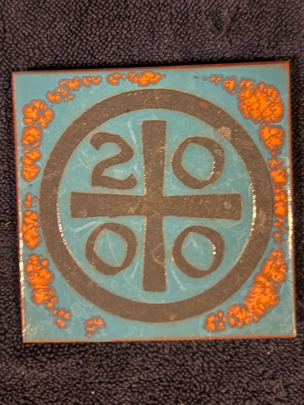 Handmade Blue and Orange Ceramic Tile with Geometric Motif
